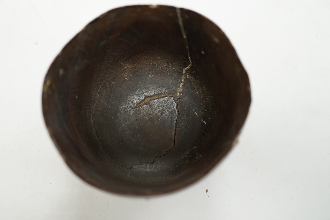 A 19th century or earlier engine-turned lignum vitae tumbler cup, engraved ‘Presented to M. S. Jones by a Friend 1834 AD 1701 +’, 6.5cm high, by repute found on the roof plate of Kenwood house London in 2012, during reno